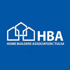 A blue and white logo of the home builders association tulsa.